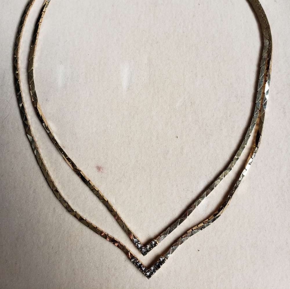 Stunning gold two chain point crystal necklace.